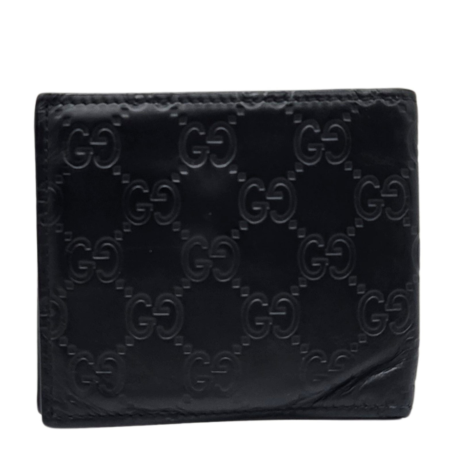 GG Embossed Monogram Leather Wallet