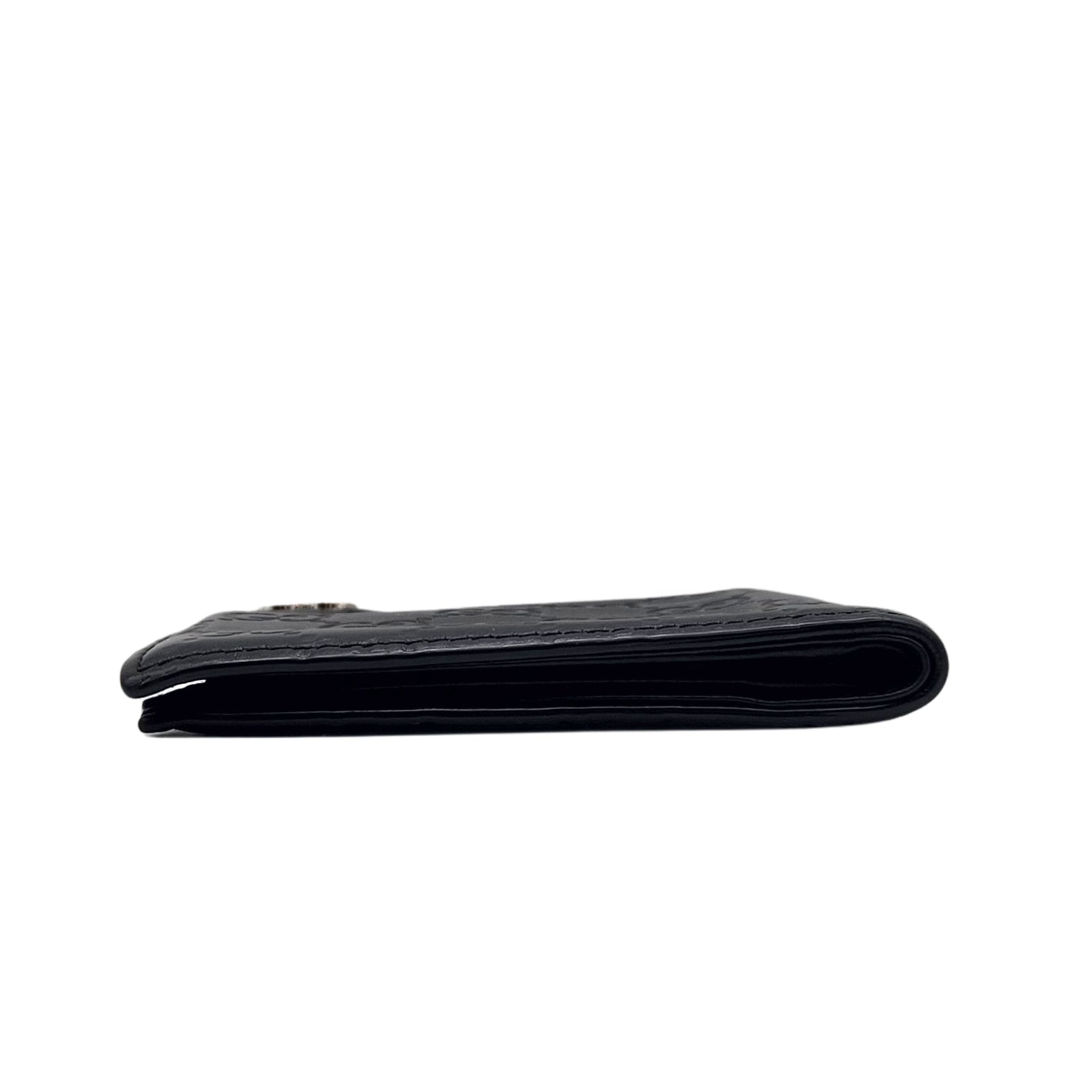 GG Embossed Monogram Leather Wallet