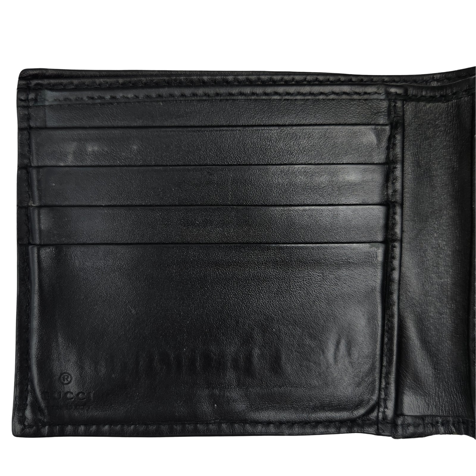 GG Embossed Monogram Leather Wallet