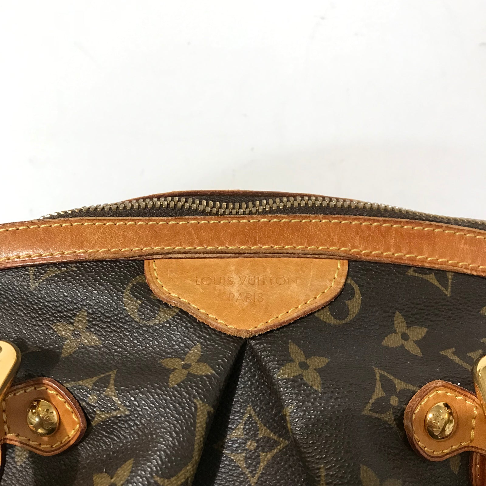 Flawed Monogram Tivoli GM