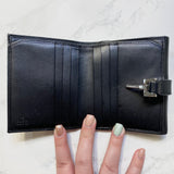Monogram Piston Lock Compact Wallet